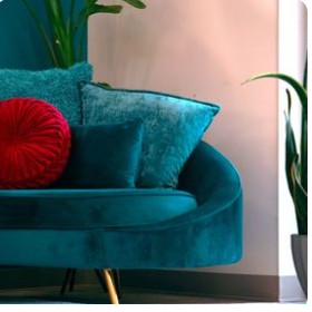 Cozy therapy office interior with teal couch and plants